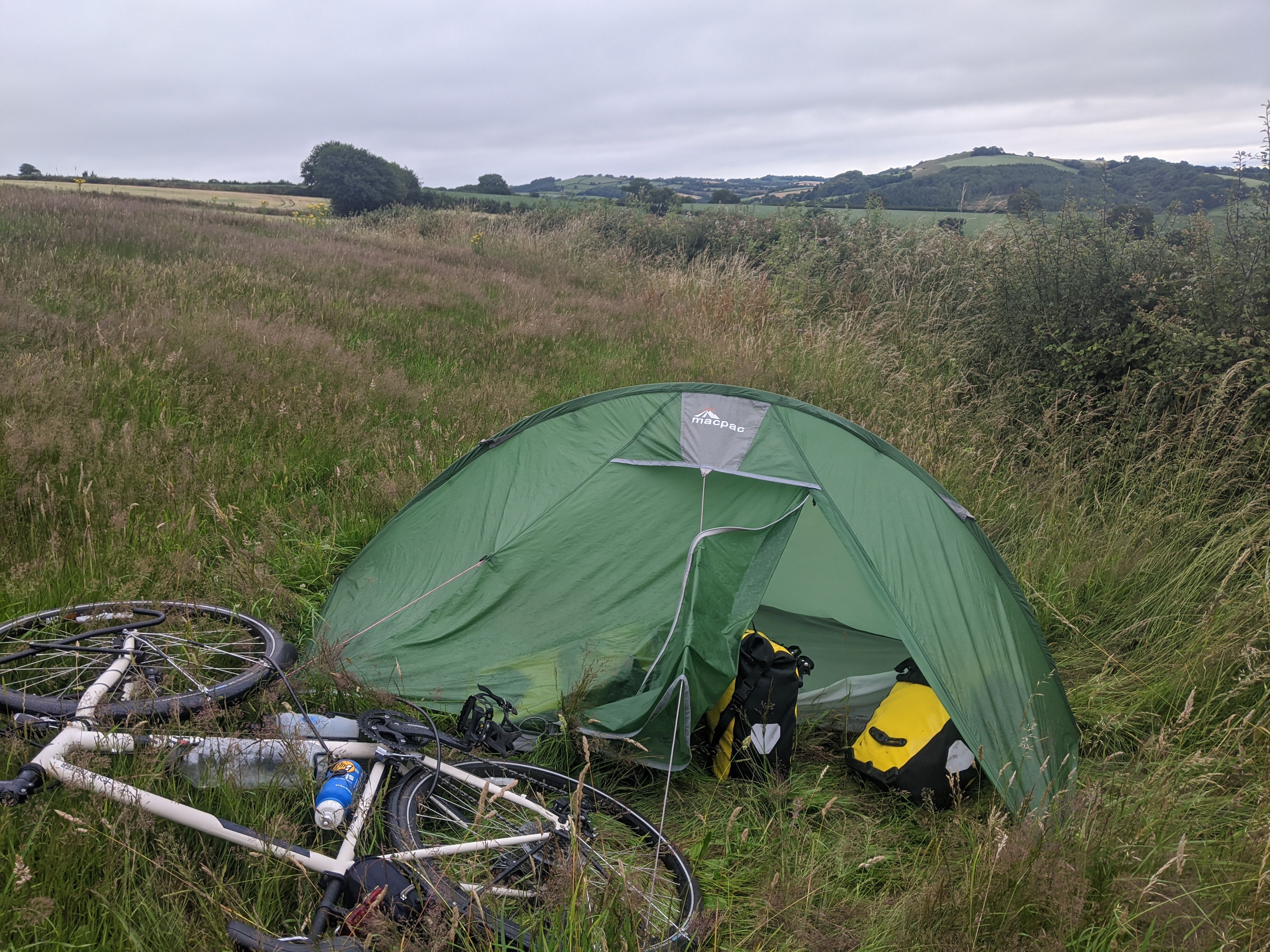 Tent pitched on the corner of a field